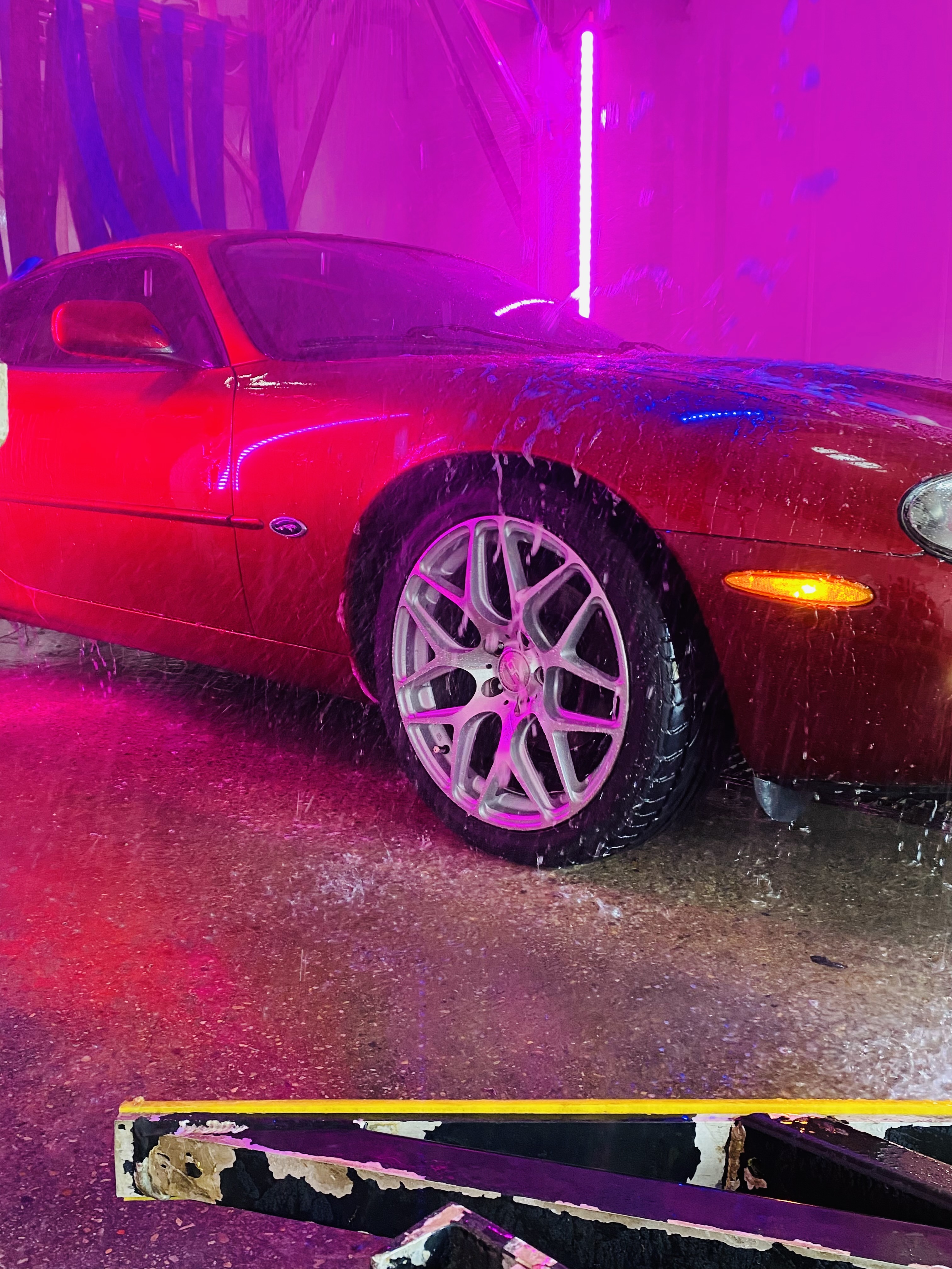 Car getting rinsed in the wash tunnel